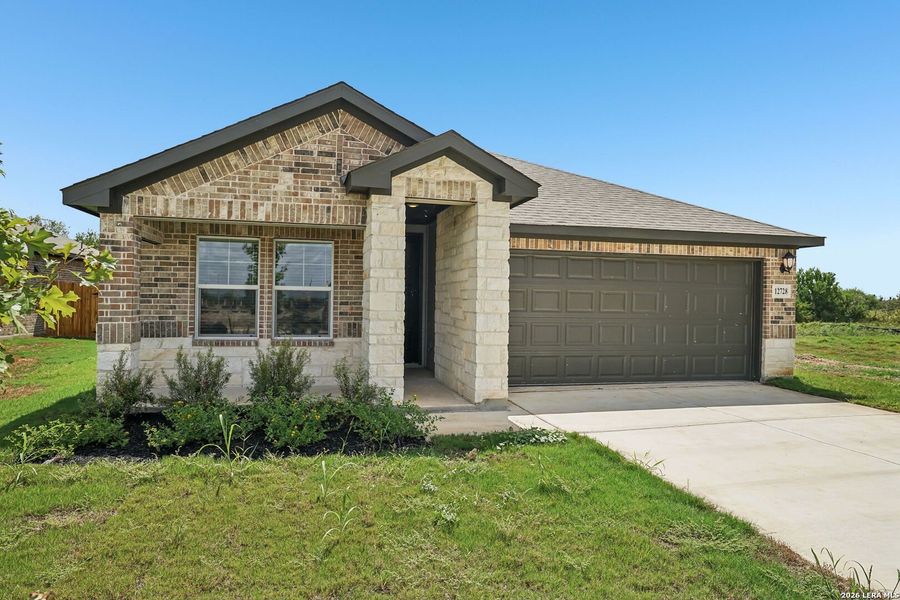 Front exterior of a new home in Carmel Ranch, Schertz, TX, highlighting curb appeal (Image 2). Front exterior of a new home in Carmel Ranch, Schertz, TX, highlighting curb appeal (Image 2).