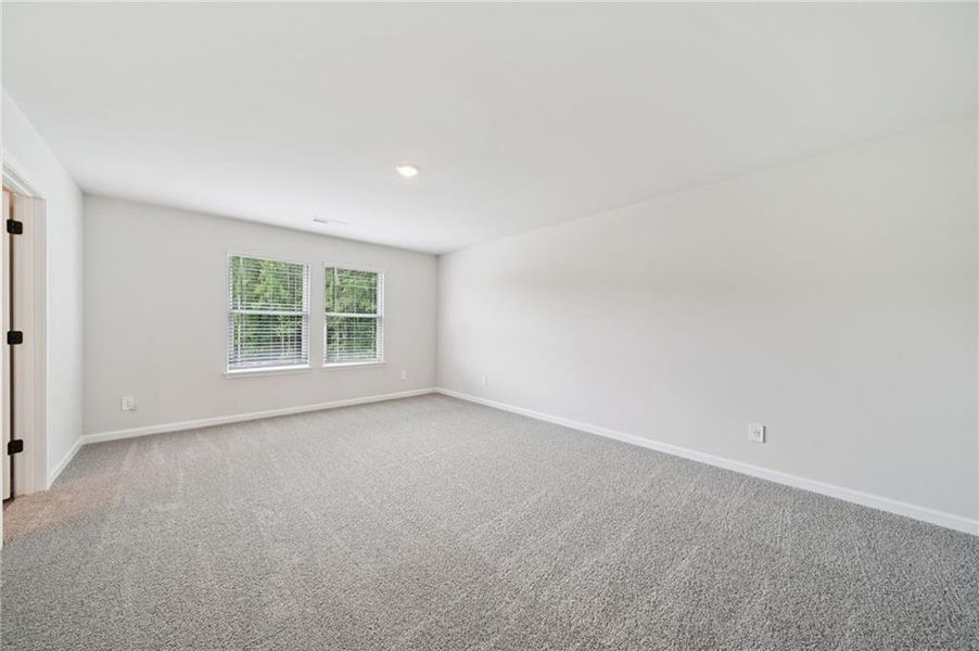 Spacious, unfurnished interior of a new home in Vines at Mill Creek - Estate Series, Braselton (Image 14).