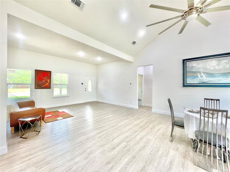 Sitting room featuring ceiling fan, visible vents, baseboards, and light wood-style flooring