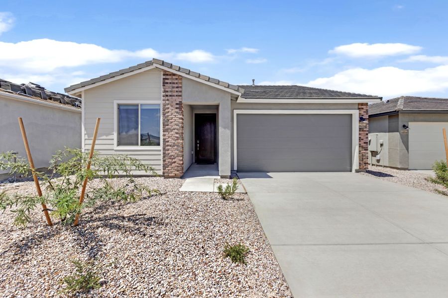 Front exterior of a new home in Cantabria at Rincon Knolls, Vail, AZ, highlighting curb appeal (Image 1). Front exterior of a new home in Cantabria at Rincon Knolls, Vail, AZ, highlighting curb appeal (Image 1).
