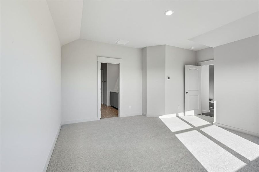 Unfurnished bedroom featuring light carpet and recessed lighting Unfurnished bedroom featuring light carpet and recessed lighting