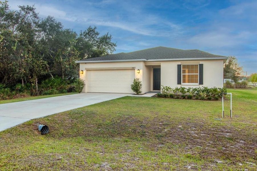 Front exterior of a new home in Poinciana, Poinciana, FL, highlighting curb appeal (Image 20). Front exterior of a new home in Poinciana, Poinciana, FL, highlighting curb appeal (Image 20).