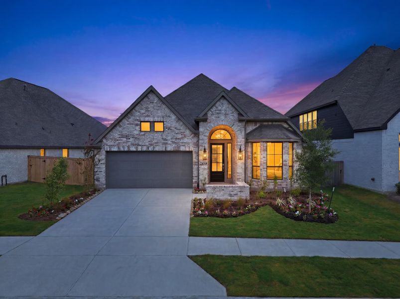 Front exterior of a new home in Bridgeland 50′, Cypress, TX, highlighting curb appeal (Image 20).