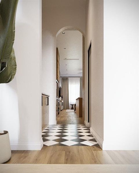 Hall with arched walkways and light wood finished floors Hall with arched walkways and light wood finished floors