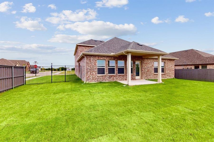 Exterior details and patio area of a home in Prairie Ridge at Goodland, Venus (Image 4).
