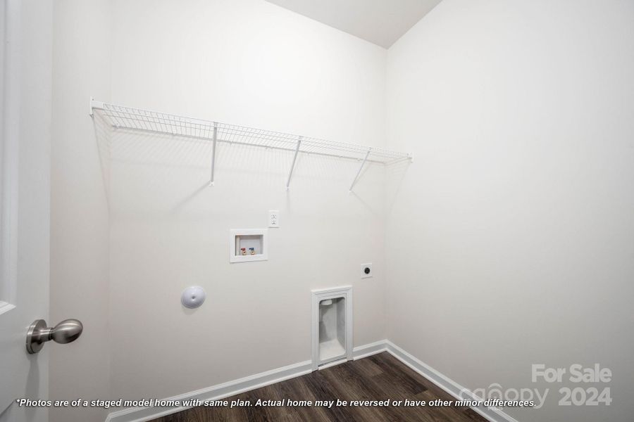 Laundry room with shelving