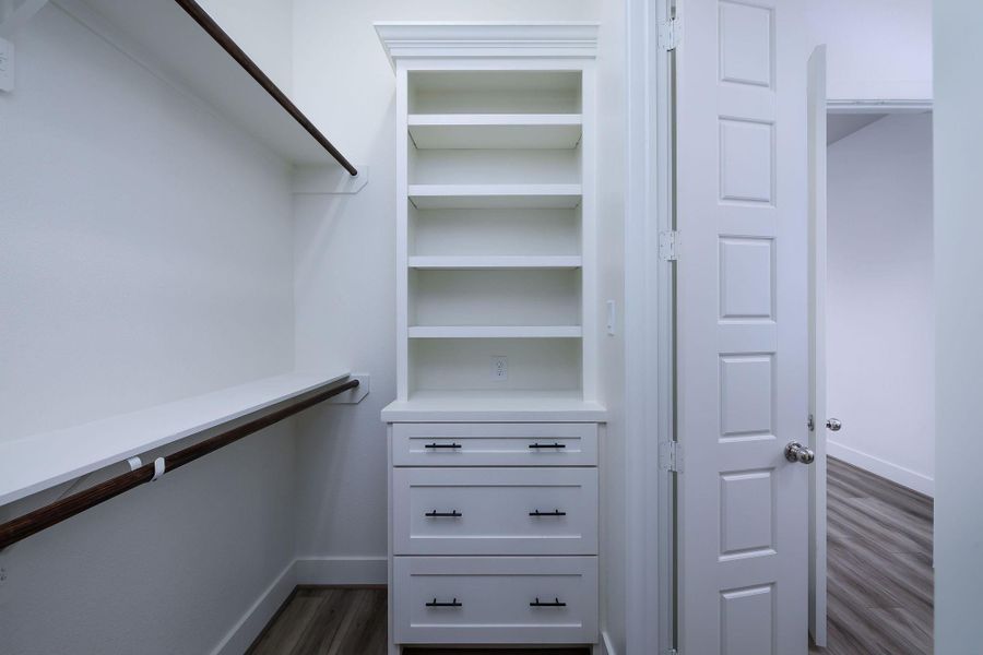 Custom cabinets and drawers in primary closet