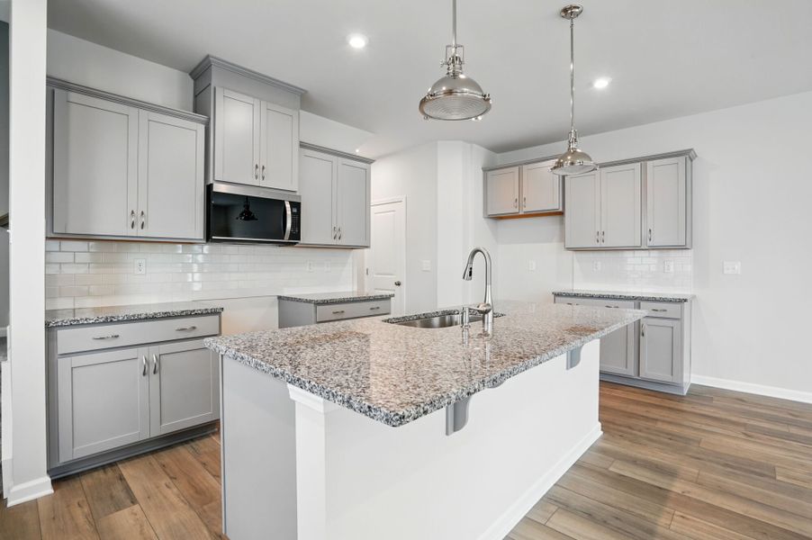 Kitchen with island breakfast bar