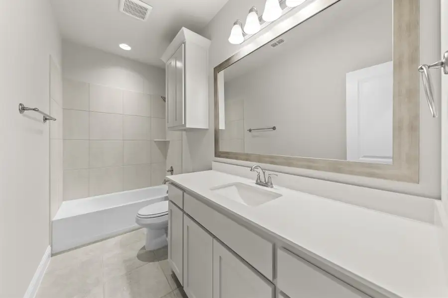 Representative furnished interior of a home built from the Portsmouth by Windsor Homes in Nelson Lake Estates, Rockwall (Image 15).