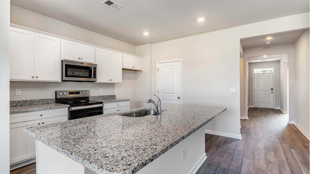 Representative furnished interior of a home built from the ARIA by D.R. Horton in Sandridge Park, Little River (Image 7).