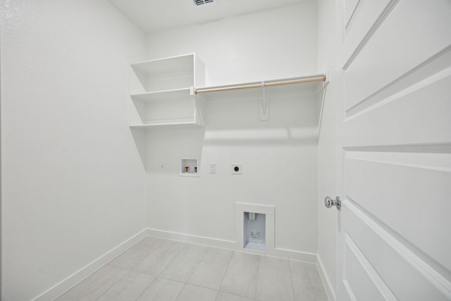 Utility Room in the Stanley II home plan by Trophy Signature Homes – REPRESENTATIVE PHOTO