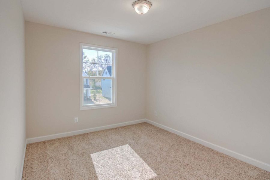 Representative unfurnished interior of a home built from the Drayton by Caviness & Cates Communities in Bartlett Manor, Youngsville (Image 237).