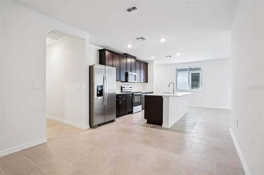 Furnished interior view inside a new home in Ridgehaven - Villas, Ormond Beach (Image 5).