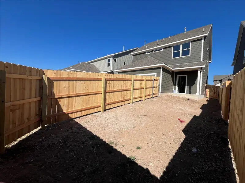 Exterior details and patio area of a home in The Cottages at Lariat, Liberty Hill (Image 4).