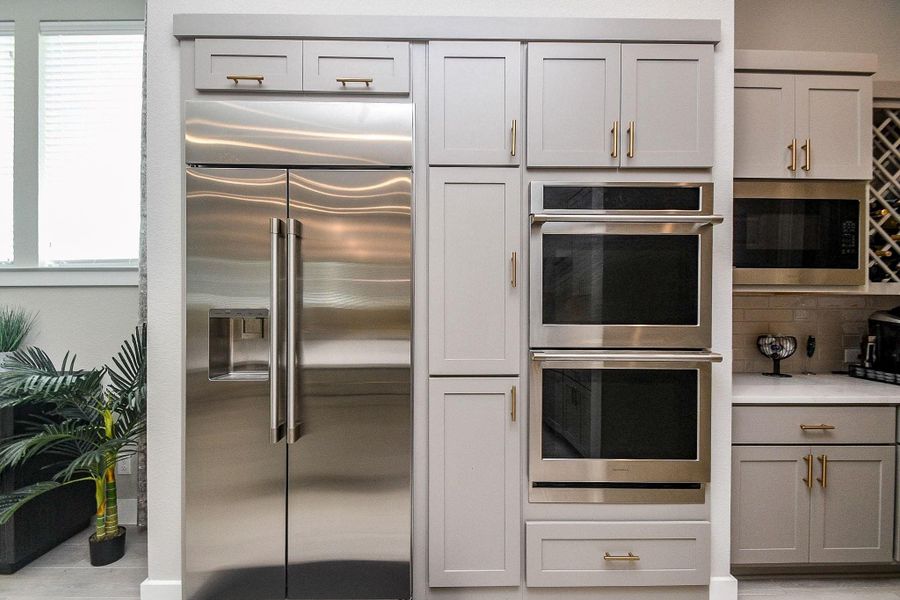 Stainless steel Monogram double wall oven with refrigerator included. Stainless steel Monogram double wall oven with refrigerator included.