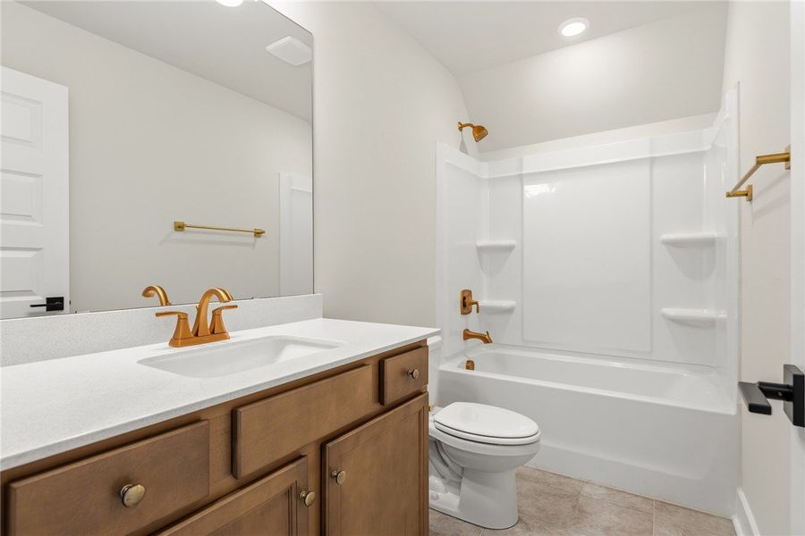 This bright bathroom features a spacious vanity wi