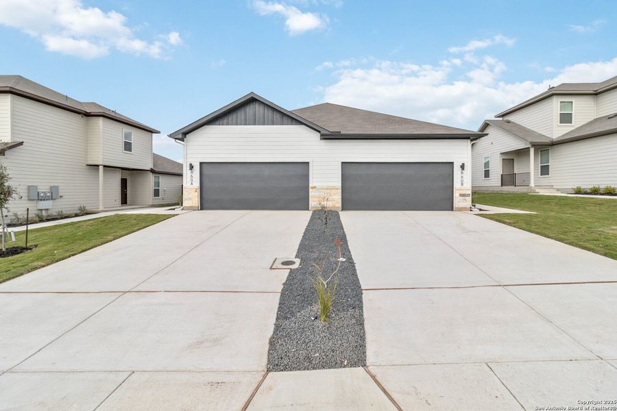 Front exterior of a new home in , San Antonio, TX, highlighting curb appeal (Image 1).