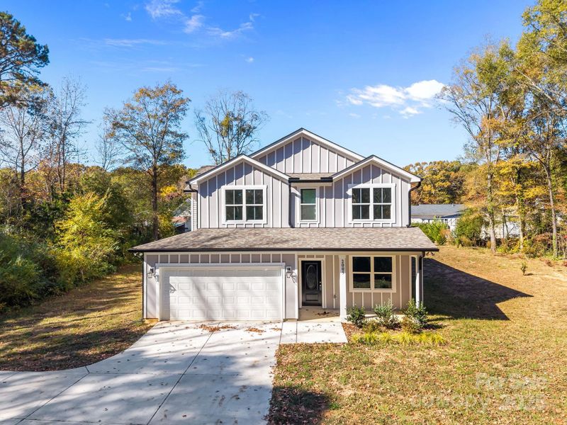 Front exterior of a new home in , Monroe, NC, highlighting curb appeal (Image 1).