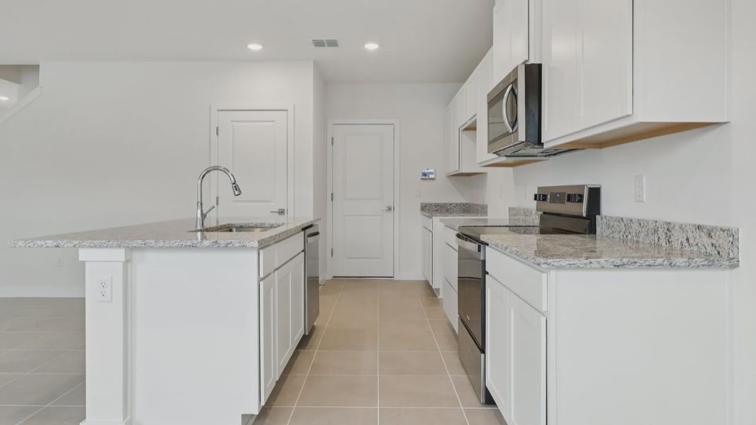 Kitchen of the Coronado - End at Cyrene at Harmony located in St Cloud FL by DRB Homes Kitchen of the Coronado - End at Cyrene at Harmony located in St Cloud FL by DRB Homes