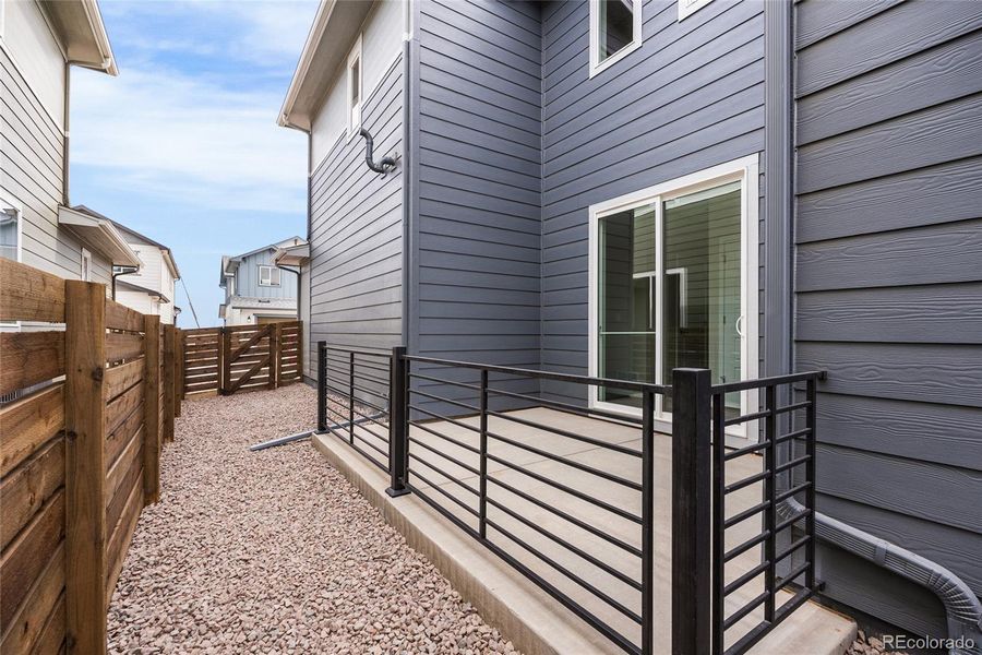 Exterior details and patio area of a home in Barefoot Village, Firestone (Image 18).