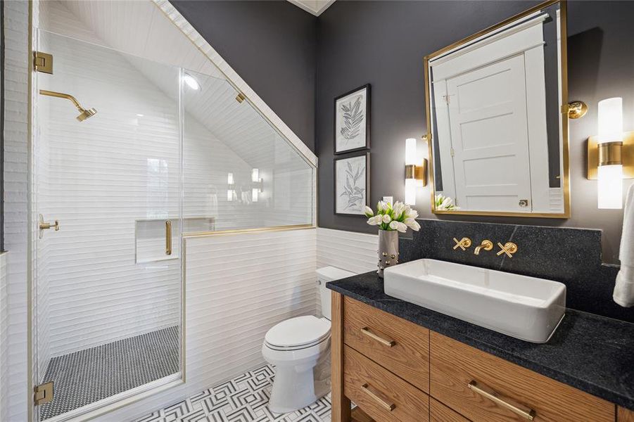 Example of a downstairs "Powder Plus" bath by The Modern Bungalow - 712 Byrne also has a stained (although differently designed) vanity cabinet.