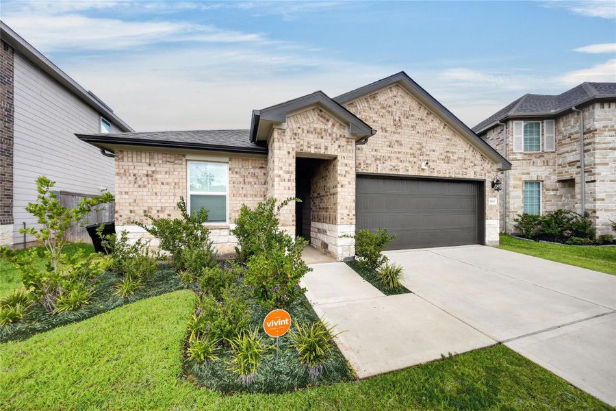 Front exterior of a new home in Magnolia Place, Magnolia, TX, highlighting curb appeal (Image 2). Front exterior of a new home in Magnolia Place, Magnolia, TX, highlighting curb appeal (Image 2).