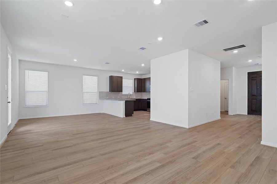 Another gorgeous view from the Family Room looking into the kitchen and dining areas.