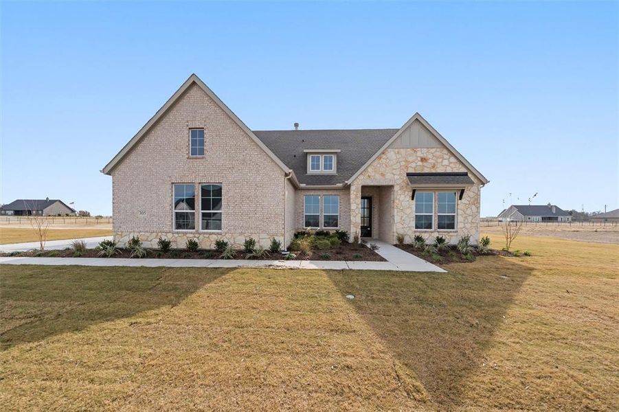 Front exterior of a new home in Eagle Ridge Estates, Weatherford, TX, highlighting curb appeal (Image 24).
