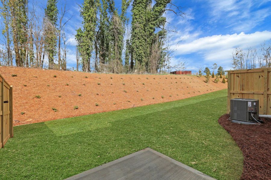 Exterior details and patio area of a home in Villas at Dawsonville Townhomes, Dawsonville (Image 3).