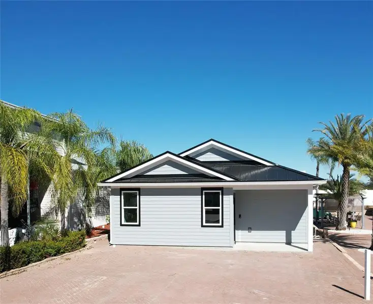Front exterior of a new home in , Davenport, FL, highlighting curb appeal (Image 18). Front exterior of a new home in , Davenport, FL, highlighting curb appeal (Image 18).