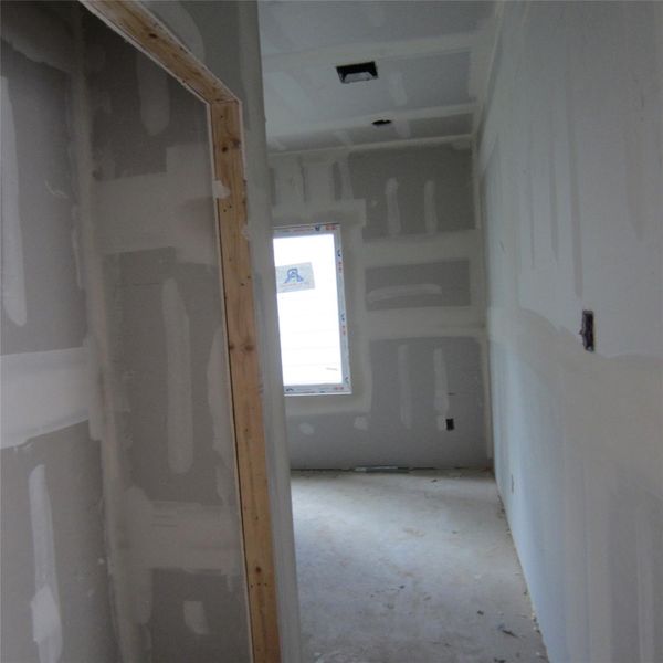 Closet with full bath and first bedroom on the ground level floor.