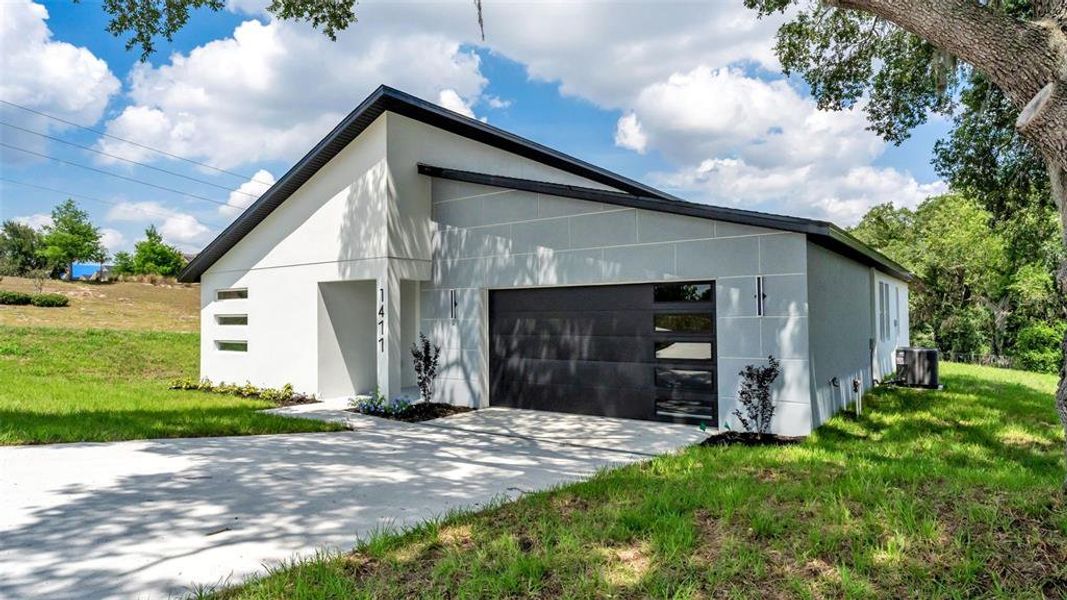 Front exterior of a new home in , Davenport, FL, highlighting curb appeal (Image 20).