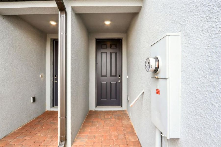 Exterior details and patio area of a home in The Meadow at Crossprairie Townes, St. Cloud (Image 4).