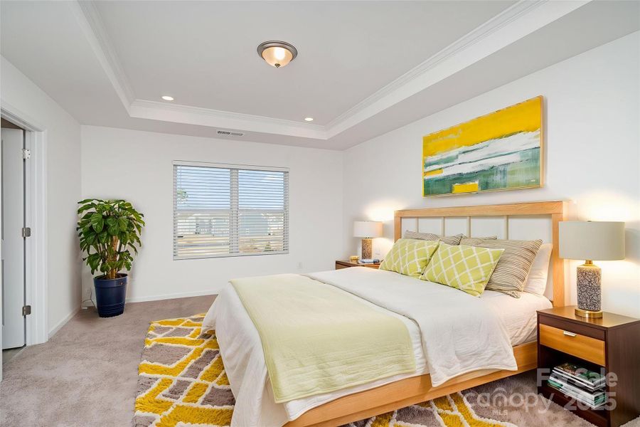 Primary bedroom *Virtually staged* Primary bedroom *Virtually staged*