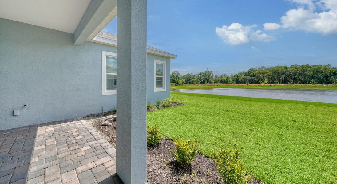Exterior details and patio area of a home in Wildleaf at North River Ranch, Parrish (Image 19).