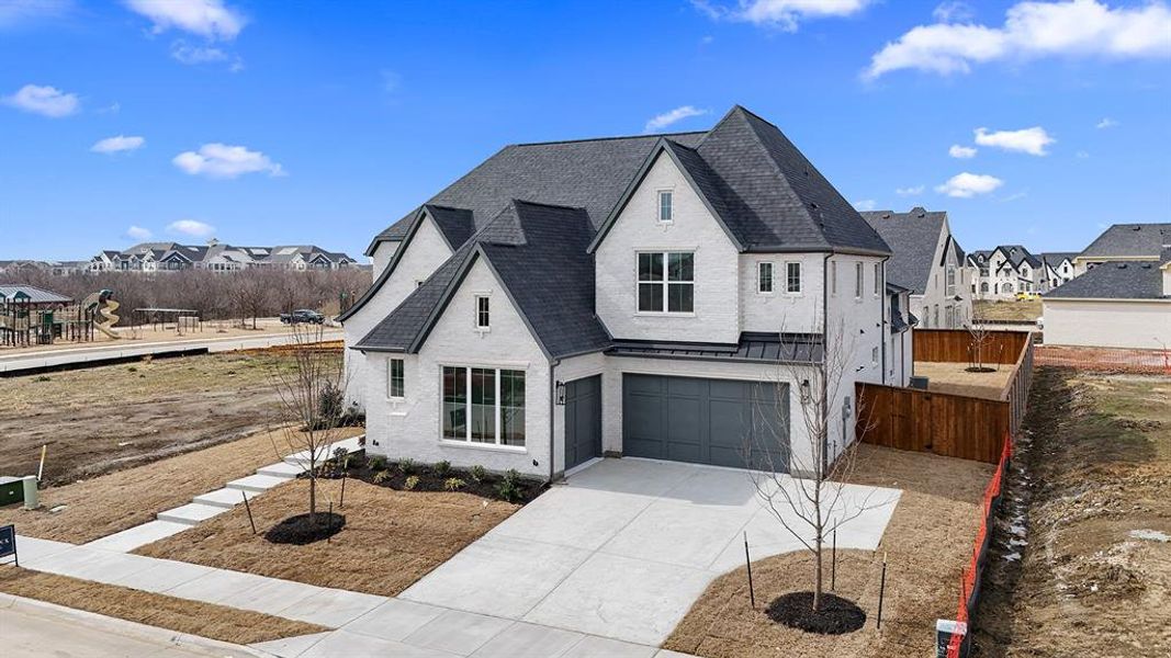 Front exterior of a new home in , Prosper, TX, highlighting curb appeal (Image 2). Front exterior of a new home in , Prosper, TX, highlighting curb appeal (Image 2).