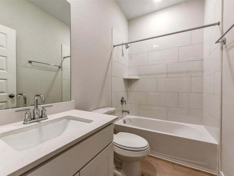 Furnished interior view inside a new home in Sunterra, Katy (Image 15).