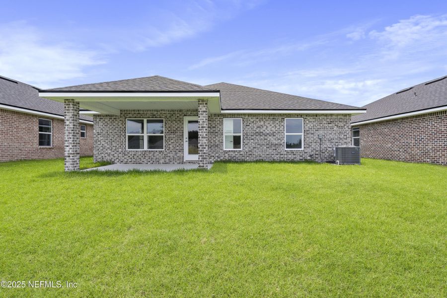 Front exterior of a new home in Shadow Crest at Rolling Hills, Green Cove Springs, FL, highlighting curb appeal (Image 15). Front exterior of a new home in Shadow Crest at Rolling Hills, Green Cove Springs, FL, highlighting curb appeal (Image 15).