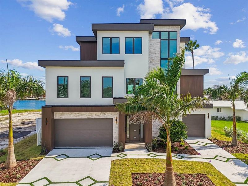 Front exterior of a new home in , Treasure Island, FL, highlighting curb appeal (Image 27). Front exterior of a new home in , Treasure Island, FL, highlighting curb appeal (Image 27).