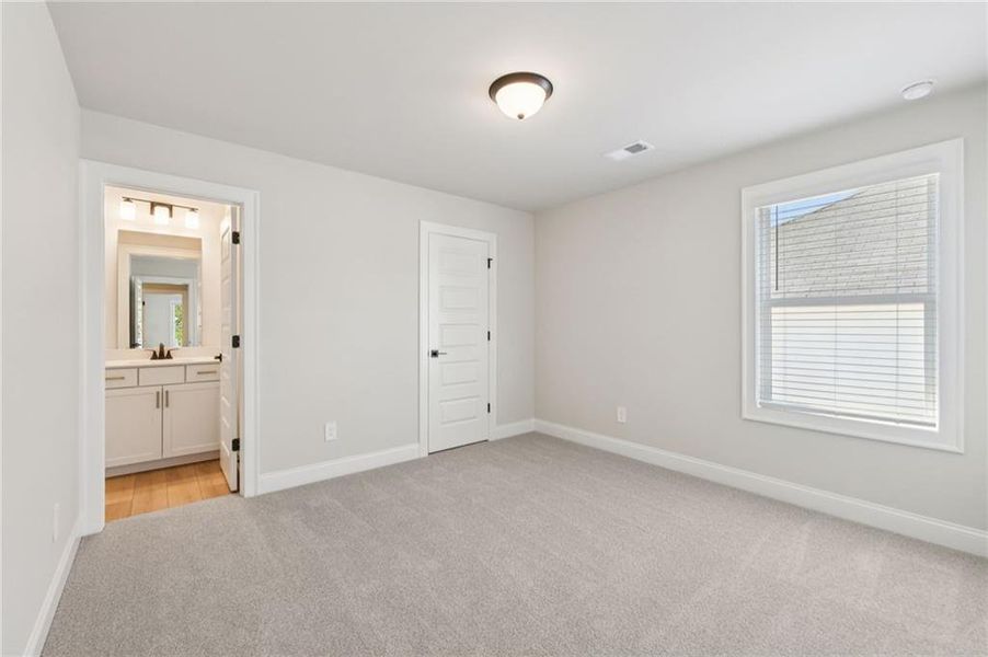 Spacious, unfurnished interior of a new home in Vines at Mill Creek - Estate Series, Braselton (Image 41).