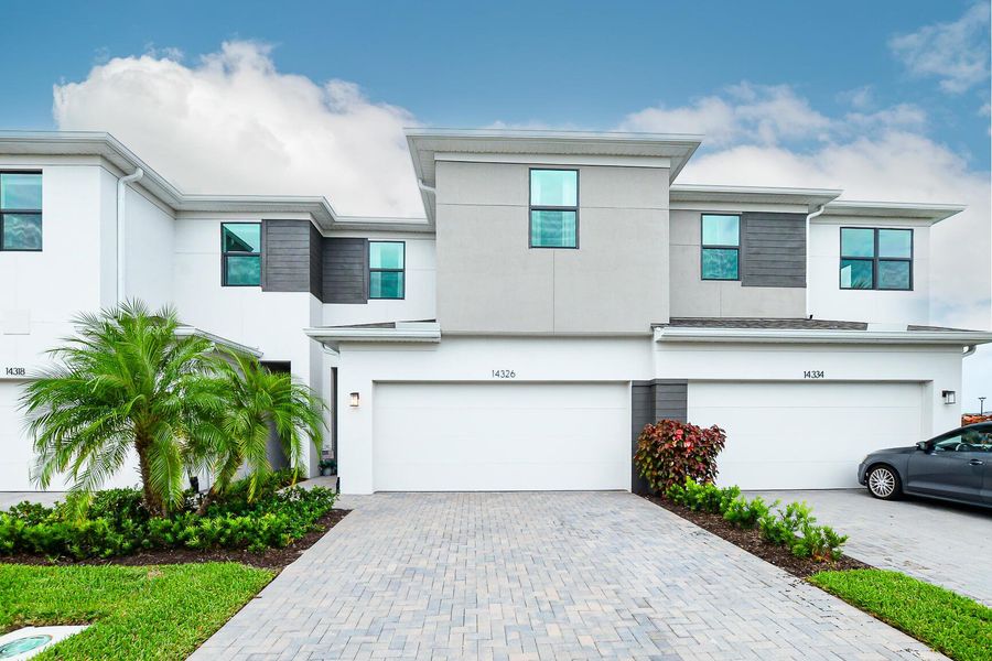 Front exterior of a new home in , Port St. Lucie, FL, highlighting curb appeal (Image 21).
