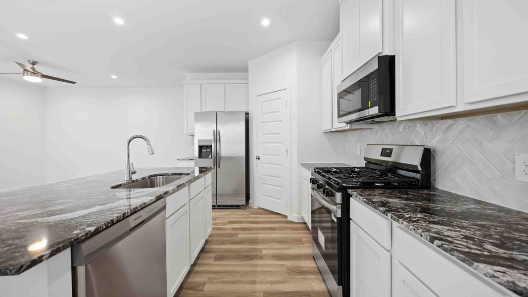Representative furnished interior of a home built from the Magnolia by D.R. Horton in Grand West, Houston (Image 5).
