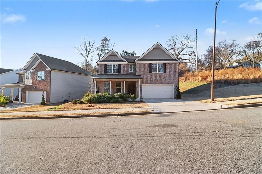 Front exterior of a new home in , Atlanta, GA, highlighting curb appeal (Image 29).