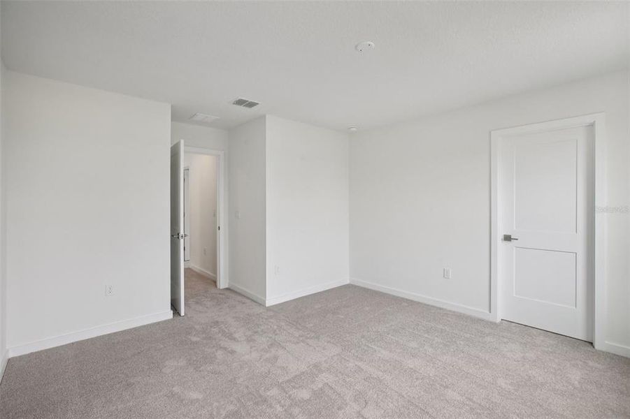 Spacious, unfurnished interior of a new home in Grasslands West, Lakeland (Image 18).