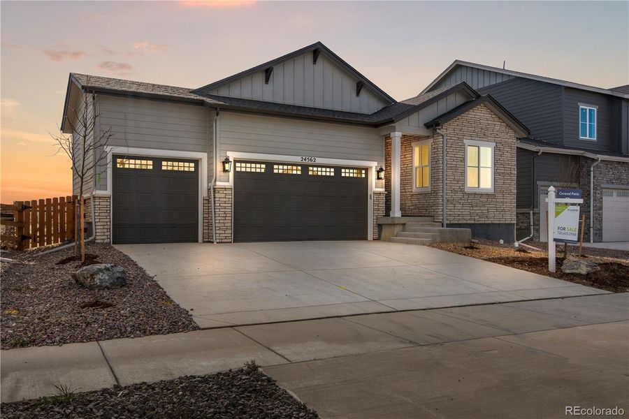 Front exterior of a new home in Prelude at The Aurora Highlands, Aurora, CO, highlighting curb appeal (Image 19). Front exterior of a new home in Prelude at The Aurora Highlands, Aurora, CO, highlighting curb appeal (Image 19).