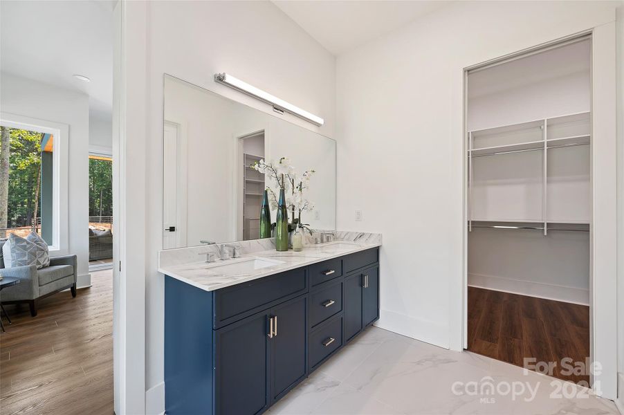 Primary dual vanities and custom closets