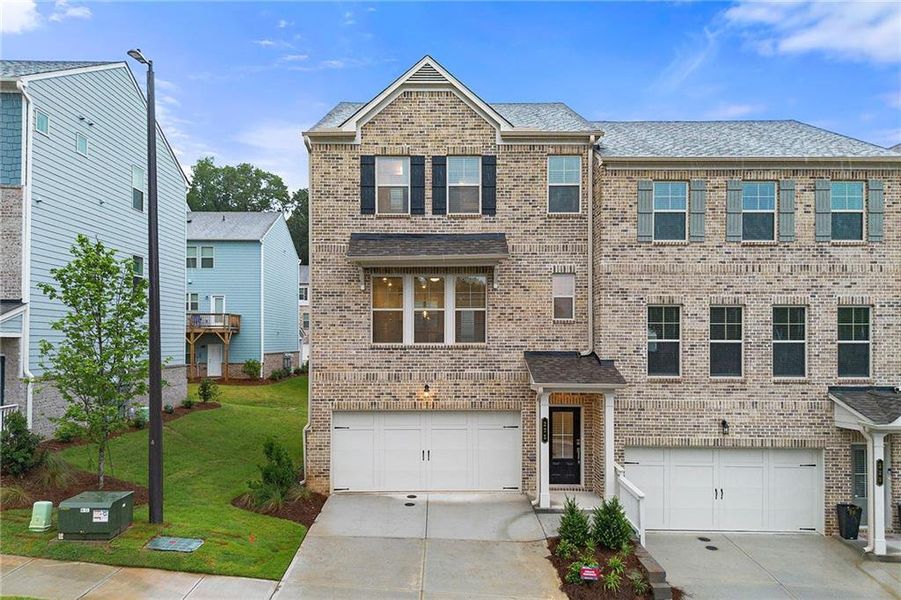 Front exterior of a new home in , Mableton, GA, highlighting curb appeal (Image 1). Front exterior of a new home in , Mableton, GA, highlighting curb appeal (Image 1).