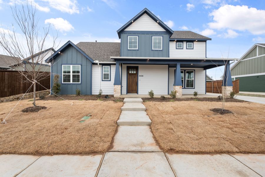 Front exterior of a new home in Heritage Towne, Midlothian, TX, highlighting curb appeal (Image 26). Front exterior of a new home in Heritage Towne, Midlothian, TX, highlighting curb appeal (Image 26).