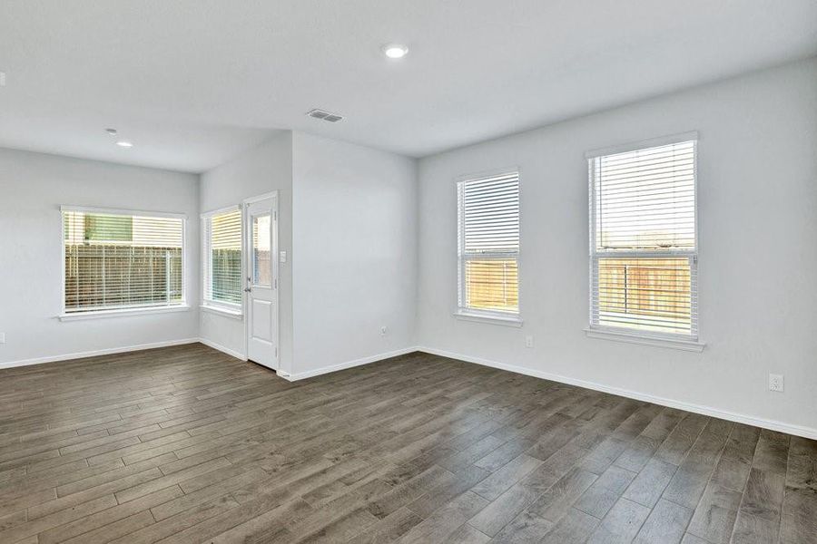 Warm wood look tile throughout the main living areas. Warm wood look tile throughout the main living areas.