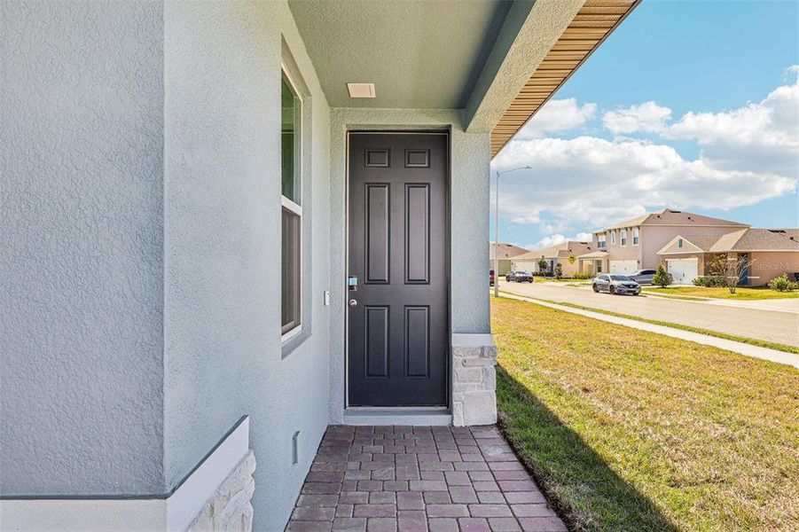 Exterior details and patio area of a home in Lake Deer Estates - Classic Series, Poinciana (Image 4).